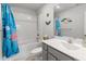 Bright bathroom featuring a shower-tub combo, single sink vanity and marine themed decorations at 5034 Moselle Ave, Fort Mill, SC 29707