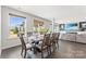 Bright dining area featuring a large window, hardwood floors, and an open-concept living space at 5034 Moselle Ave, Fort Mill, SC 29707