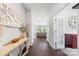 Bright foyer featuring hardwood floors, decorative mirror, table, and an open view to the living room at 5034 Moselle Ave, Fort Mill, SC 29707