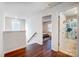 Upstairs hallway featuring dark floors and views into adjacent rooms and bathroom at 5034 Moselle Ave, Fort Mill, SC 29707