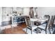 Modern eat-in kitchen with dark wood flooring, updated cabinets, and stainless appliances at 5034 Moselle Ave, Fort Mill, SC 29707