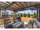 Outdoor patio with comfortable seating, a dining table, and a built in grill at 5034 Moselle Ave, Fort Mill, SC 29707