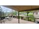 A spacious back deck with a dining area and pergola at 5527 Dallas High Shoals Hwy Hwy, Dallas, NC 28034