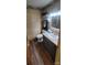 Bathroom with updated vanity, shower, and decorative wallpaper at 5527 Dallas High Shoals Hwy Hwy, Dallas, NC 28034