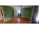 Bright bedroom with wood floors, a closet, and green walls at 5527 Dallas High Shoals Hwy Hwy, Dallas, NC 28034