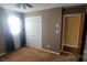 Spacious bedroom with double doors and a large window at 5527 Dallas High Shoals Hwy Hwy, Dallas, NC 28034