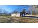 Detached garage with brick exterior and a single door at 5527 Dallas High Shoals Hwy Hwy, Dallas, NC 28034