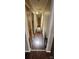 Long hallway with dark hardwood floors and access to bedrooms at 5527 Dallas High Shoals Hwy Hwy, Dallas, NC 28034