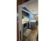 Modern kitchen with gray cabinets, white countertops, and a breakfast bar at 5527 Dallas High Shoals Hwy Hwy, Dallas, NC 28034