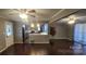 Open concept living room with hardwood floors and kitchen at 5527 Dallas High Shoals Hwy Hwy, Dallas, NC 28034