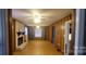 Living room with fireplace, hardwood floors, and wood paneling at 5527 Dallas High Shoals Hwy Hwy, Dallas, NC 28034