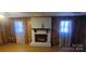 Living room with fireplace and hardwood floors at 5527 Dallas High Shoals Hwy Hwy, Dallas, NC 28034