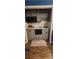 Built-in wet bar with gray cabinets and granite countertop at 5527 Dallas High Shoals Hwy Hwy, Dallas, NC 28034