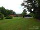 Large backyard with mature trees and open space at 5590 S Nc 16 Business Hwy, Maiden, NC 28650