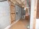 Unfinished basement with exposed pipes and block walls at 5590 S Nc 16 Business Hwy, Maiden, NC 28650