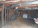 Unfinished basement with exposed piping, brick walls and a stove at 5590 S Nc 16 Business Hwy, Maiden, NC 28650