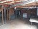 Unfinished basement with exposed piping, brick walls and a stove at 5590 S Nc 16 Business Hwy, Maiden, NC 28650
