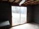 Unfinished basement with sliding glass doors to the exterior, bare ceiling, and concrete flooring at 5590 S Nc 16 Business Hwy, Maiden, NC 28650