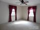 Bedroom with two windows, ceiling fan, and carpet flooring at 5590 S Nc 16 Business Hwy, Maiden, NC 28650