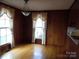 Simple dining area with hardwood floors and wood paneling at 5590 S Nc 16 Business Hwy, Maiden, NC 28650