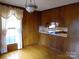 Bright dining room with hardwood floors and wood paneling at 5590 S Nc 16 Business Hwy, Maiden, NC 28650