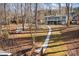 Two-story home with lake access, walkway, and dock at 604 Beaten Path Rd, Mooresville, NC 28117