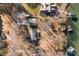 Aerial view of lakeside home with private dock and spacious yard at 604 Beaten Path Rd, Mooresville, NC 28117