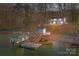 Lakefront home at dusk; private dock at 604 Beaten Path Rd, Mooresville, NC 28117