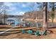 Lakefront backyard with firepit and seating at 604 Beaten Path Rd, Mooresville, NC 28117