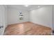 Bright bedroom with hardwood floors and a window at 604 Beaten Path Rd, Mooresville, NC 28117