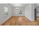 Bright dining room features hardwood floors and wainscoting at 604 Beaten Path Rd, Mooresville, NC 28117