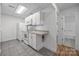 Updated kitchen with white cabinets and view of bathroom at 604 Beaten Path Rd, Mooresville, NC 28117