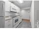 Kitchen with white cabinets, granite counters, and appliances at 604 Beaten Path Rd, Mooresville, NC 28117
