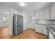 Bright kitchen featuring stainless steel appliances and granite countertops at 604 Beaten Path Rd, Mooresville, NC 28117