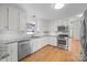 Modern kitchen boasts stainless steel appliances and granite countertops at 604 Beaten Path Rd, Mooresville, NC 28117