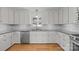 Updated kitchen with white cabinets, granite counters, and stainless steel appliances at 604 Beaten Path Rd, Mooresville, NC 28117