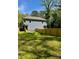 Fenced backyard, side view of a gray home with plenty of yard space for activities and enjoying nature at 625 Colorado Ave # B, Charlotte, NC 28206