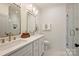 Modern bathroom featuring a double vanity, stylish lighting, and a glass-enclosed walk-in shower at 625 Colorado Ave # B, Charlotte, NC 28206