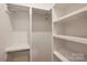 Well-organized walk-in closet with ample shelving and hanging space for clothing and accessories at 625 Colorado Ave # B, Charlotte, NC 28206