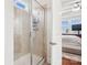 Shower with tile walls, glass door, and view into the adjacent bedroom at 746 Waterscape Ct, Rock Hill, SC 29730