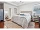 Spacious bedroom with hardwood floors, neutral colors, and a tray ceiling at 746 Waterscape Ct, Rock Hill, SC 29730