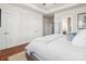 Bright bedroom with wood floors, white trim, and two closets providing ample storage space at 746 Waterscape Ct, Rock Hill, SC 29730