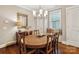 Formal dining room with wood floors and a window seat, perfect for entertaining at 746 Waterscape Ct, Rock Hill, SC 29730