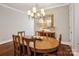 Formal dining room featuring an oval wooden table and stylish chandelier at 746 Waterscape Ct, Rock Hill, SC 29730