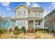 Charming two-story home with inviting front porch, manicured landscaping and bright green door at 746 Waterscape Ct, Rock Hill, SC 29730