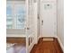 Bright foyer with hardwood floors, white trim, and a glimpse into the living room at 746 Waterscape Ct, Rock Hill, SC 29730