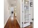 Long hallway with hardwood floors and white trim, leading to other rooms at 746 Waterscape Ct, Rock Hill, SC 29730