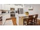 Bright kitchen boasts stainless steel appliances, granite countertops, and stylish white cabinetry at 746 Waterscape Ct, Rock Hill, SC 29730