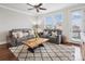 Bright Living Room features hardwood floors, neutral decor, and large windows at 746 Waterscape Ct, Rock Hill, SC 29730