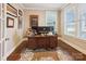 Home office with bright lighting, hardwood floors and stylish Tiger themed decor at 746 Waterscape Ct, Rock Hill, SC 29730
